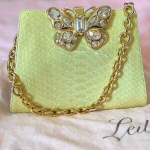 Judith Leiber RARE- light green snakeskin clutch with bejeweled butterfly clasp